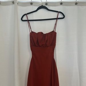 Burnt orange/ copper dress. Open back and slit on the side. Only worn once!